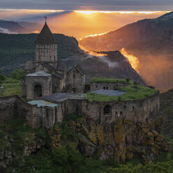 Aerial view of Tatev Monastery on the rocks, a monastery complex with view over the valley and mountains, Tatev, Syunik Province, Armenia. - AAEF22998