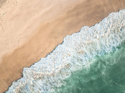Aerial Top Down View Of Blue Ocean Waves Breaking Onto Sand At Bronte Beach, Sydney, Australia. - AAEF23051