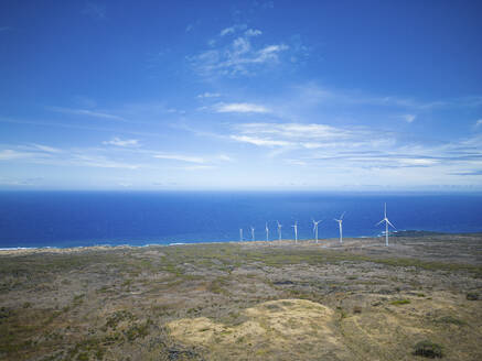 Aerial View of wind turbines along the coastline, South Pacific, Maui, Hawaii, United States. - AAEF23105