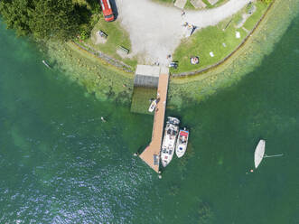 Aerial View of sailing boat docket along the Pier on Lake Zurich, Zurich, Switzerland. - AAEF23119