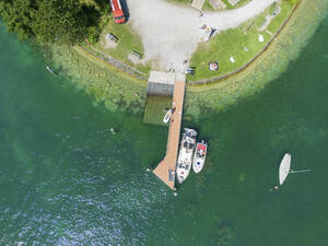 Aerial View of sailing boat docket along the Pier on Lake Zurich, Zurich, Switzerland. - AAEF23119