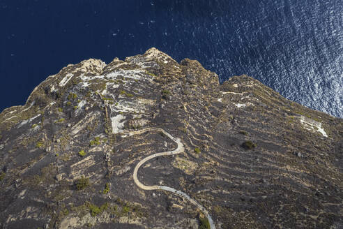 Aerial view of an off-road path along the coastline on the cliffs in Dingli, Malta. - AAEF23130