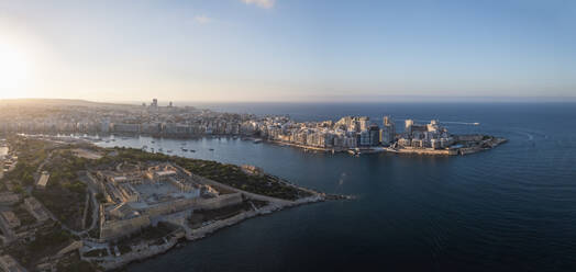 Panoramic aerial view of La Valletta city downtown at sunset along the bay in Malta. - AAEF23164