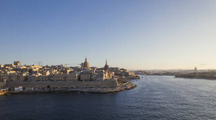 Aerial view of La Valletta city downtown at sunset along the bay in Malta. - AAEF23165