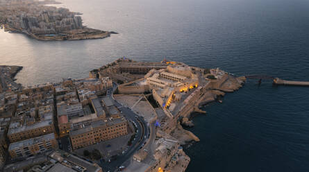 Aerial view of Fort Sant Elmo at the point of La Valletta downtown at sunset in Malta. - AAEF23181