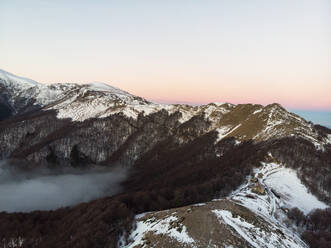 Aerial Drone View of Balkan Mountains in the Morning, Peeshti mountain peak in winter, Valevtsi, Gabrovo, Bulgaria. - AAEF23207