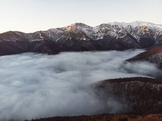 Aerial View of Balkan Mountains Range in the Mist, Peeshti mountain peak in winter, Valevtsi, Gabrovo, Bulgaria. - AAEF23211