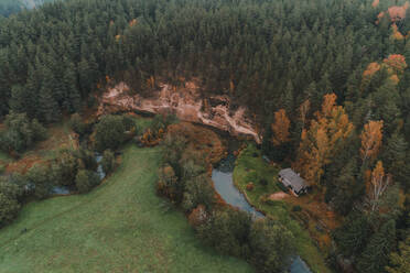 Aerial view of Harma sandstone walls and colourful trees in Piusa river ancient valley in, Vorumaa, Estonia. - AAEF23274