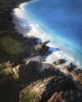 Aerial view of a person on the beach at Injidup Beach, Yallingup, Western Australia. - AAEF23310