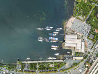 Aerial view of a shipyard in Arona, a small town along the Lago Maggiore (Lake Maggiore) at sunset, Novara, Piedmont, Italy. - AAEF23333