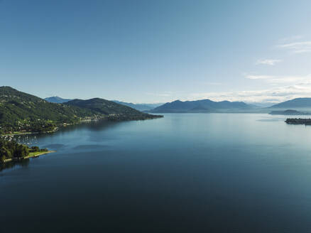 Aerial view of Lago Maggiore (Lake Maggiore) at sunrise, Meina, Novara, Piedmont, Italy. - AAEF23337