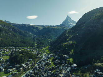 Aerial view of the Matterhorn, an iconic mountain peak with Zermatt town on foreground, Swiss Alps in summertime, Valais, Switzerland. - AAEF23359