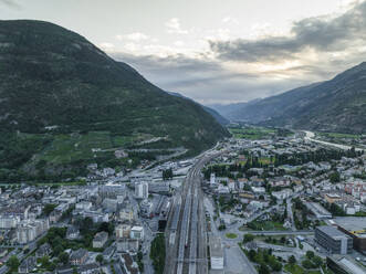 Aerial view of Visp, a small town among the Swiss Alps mountains at sunset, Valais, Switzerland. - AAEF23364