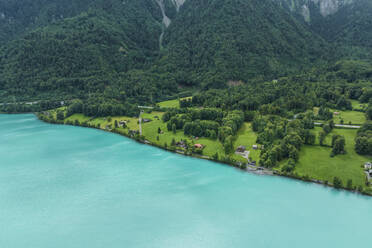 Aerial view of Brienzersee Lake in summertime during a rainy day with low clouds, Bonigen, Bern, Switzerland. - AAEF23372