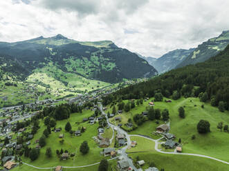 Aerial view of Grindelwald, a small town in the valley on the Swiss Alps, Canton of Bern, Switzerland. - AAEF23414