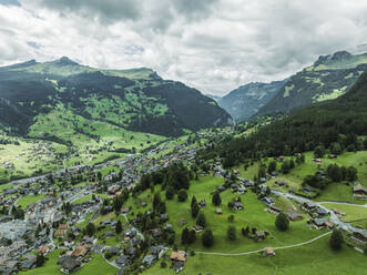 Aerial view of Grindelwald, a village on Bernese Alps in the Jungfrau region, Swiss Alps, Canton of Bern, Switzerland. - AAEF23417