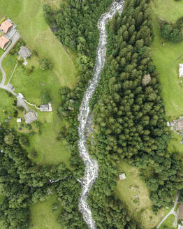 Aerial view of Schwarze Lutschine river in Grindelwald town, Bern, Switzerland. - AAEF23424