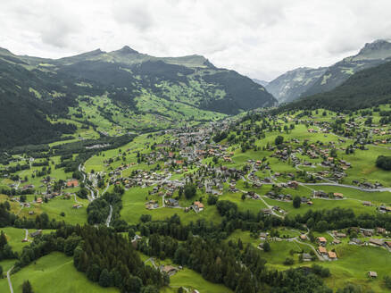 Aerial view of Grindelwald, a village on Bernese Alps in the Jungfrau region, Swiss Alps, Canton of Bern, Switzerland. - AAEF23427