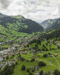 Aerial view of Grindelwald, a village on Bernese Alps in the Jungfrau region, Swiss Alps, Canton of Bern, Switzerland. - AAEF23428