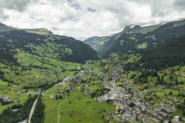 Aerial view of Grindelwald, a village on Bernese Alps in the Jungfrau region, Swiss Alps, Canton of Bern, Switzerland. - AAEF23431