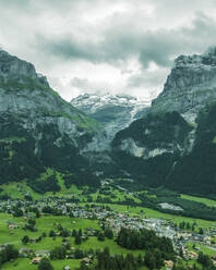 Aerial view of Bernese Alps in Grindelwald town in summertime, Swiss Alps, Canton of Bern, Switzerland. - AAEF23441