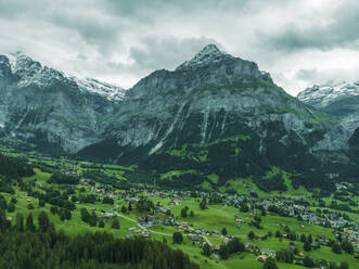 Aerial view of Bernese Alps in Grindelwald town in summertime, Swiss Alps, Canton of Bern, Switzerland. - AAEF23442