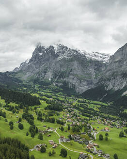 Aerial view of Bernese Alps in Grindelwald town in summertime, Swiss Alps, Canton of Bern, Switzerland. - AAEF23445