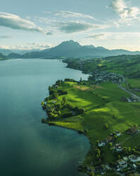 Aerial view of Mount Pilatus at sunset from Lake Lucerne, a mountain peak in Alpnach, Switzerland. - AAEF23450