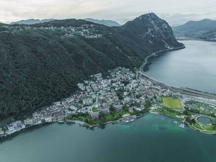 Aerial view of Melide, a small town along the Lugano Lake at sunset in Ticino, Switzerland. - AAEF23481