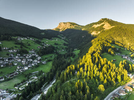 Aerial view of Ortisei, a small village on the Dolomites mountains at sunset, Trentino, South Tyrol in Northern Italy. - AAEF23535