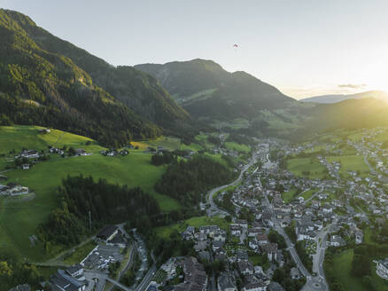 Aerial view of Ortisei, a small village on the Dolomites mountains at sunset, Trentino, South Tyrol in Northern Italy. - AAEF23538