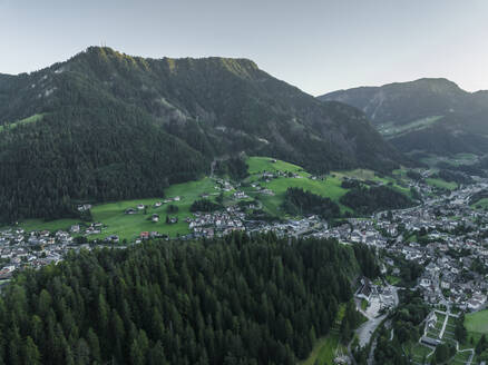 Aerial view of Ortisei, a small village on the Dolomites mountains at sunset, Trentino, South Tyrol in Northern Italy. - AAEF23542