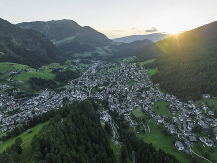 Aerial view of Ortisei, a small village on the Dolomites mountains at sunset, Trentino, South Tyrol in Northern Italy. - AAEF23544