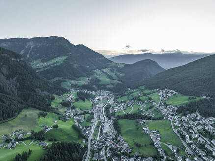 Aerial view of Ortisei, a small village on the Dolomites mountains at sunset, Trentino, South Tyrol in Northern Italy. - AAEF23551