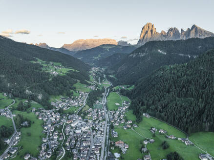 Aerial view of Ortisei, a small village on the Dolomites mountains at sunset, Trentino, South Tyrol in Northern Italy. - AAEF23552