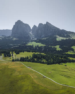 Aerial view of Sassolungo (Langkofel), a mountain peak on the Dolomites from Alpe di Siusi (Seiser Alm) in Trentino, South Tyrol in Northern Italy. - AAEF23556