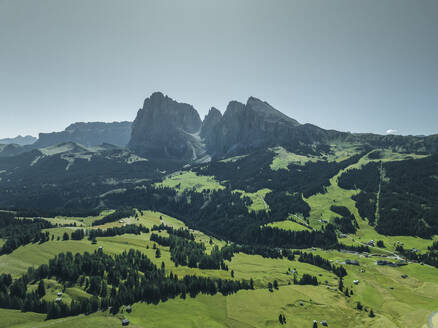 Aerial view of Sassolungo (Langkofel), a mountain peak on the Dolomites from Alpe di Siusi (Seiser Alm) in Trentino, South Tyrol in Northern Italy. - AAEF23559