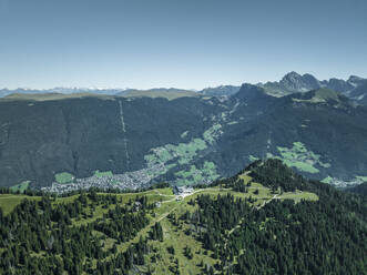 Aerial view of the mountain ridge at the top of Alpe di Siusi (Seiser Alm) on the Dolomites mountains with Secede peak in background, Ortisei, Trentino, South Tyrol in Northern Italy. - AAEF23567