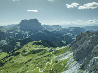 Aerial view of Sassolungo mountain as seen from Passo Gardena on the Dolomites Mountains, Trentino, South Tyrol, Italy. - AAEF23596