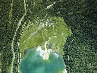 Aerial top down view of Dobbiaco Lake on the Dolomites mountain range, Toblach, Trentino, South Tyrol, Italy. - AAEF23633