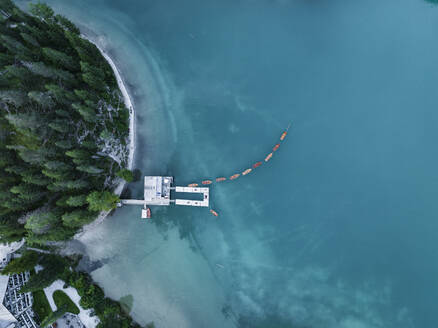 Aerial view of touristic boats along Braies Lake (Pragser Wildsee), coastline at Fanes-Senes-Braies Nature Park, Dolomites, Trentino, South Tyrol, Italy. - AAEF23647