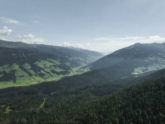 Aerial view of Versciaco town as seen from Croda dei Baranci (Birkenkofel) mountain peak on the Dolomites range, Trentino, South Tyrol, Italy. - AAEF23657