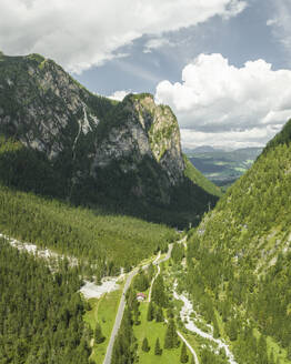 Aerial view of a road across the mountain peaks near the Tre Cime Natural park (Drei Zinnen) on the Dolomites area, Trentino, South Tyrol, Italy. - AAEF23661