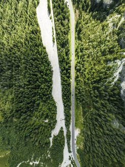 Aerial view of vehicles driving on a mountain road with forest trees near Landro Lake (Durrensee) on Dolomites area, Upper Val Pusteria, Trentino, South Tyrol, Italy. - AAEF23665