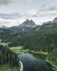 Aerial view of Misurina Lake at sunset with Tre Cime di Lavaredo peaks in background, Auronzo di Cadore, Dolomites, Veneto, Italy. - AAEF23677