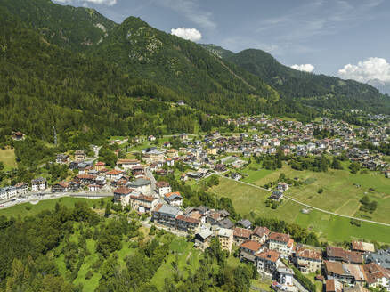 Aerial view of Valle di Cadore, a small town among the mountains on the Dolomites in Veneto, Belluno, Italy. - AAEF23692