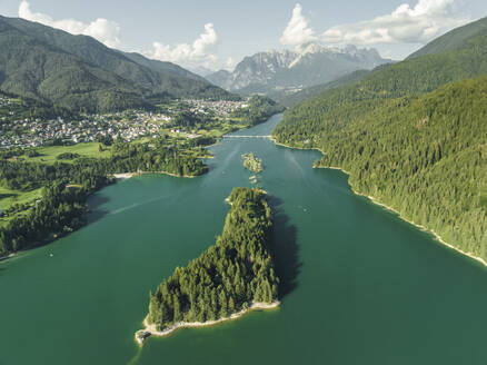 Aerial view of Caprioli Island (Isola dei Caprioli) on Cadore Lake (Lago di Cadore) on the Dolomites Mountains, Belluno, Veneto, Italy. - AAEF23709