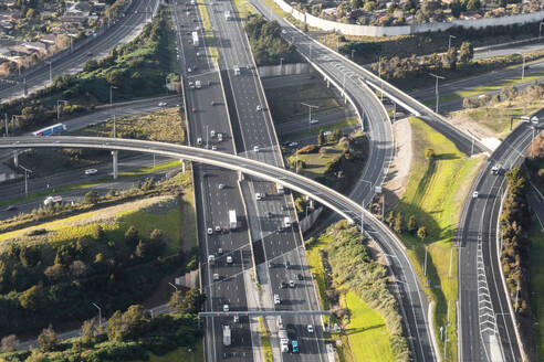 Aerial view of Cars Navigate Complex Highway Interchange, Victoria, Australia. - AAEF23873