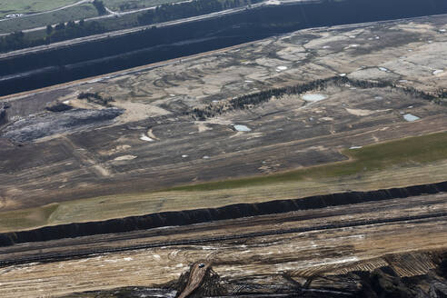 Aerial view of Isolated Vehicle in Vast Open Mine Landscape, Victoria, Australia. - AAEF23941