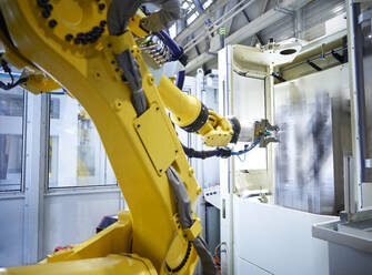 Yellow robotic arm in factory - CVF02689